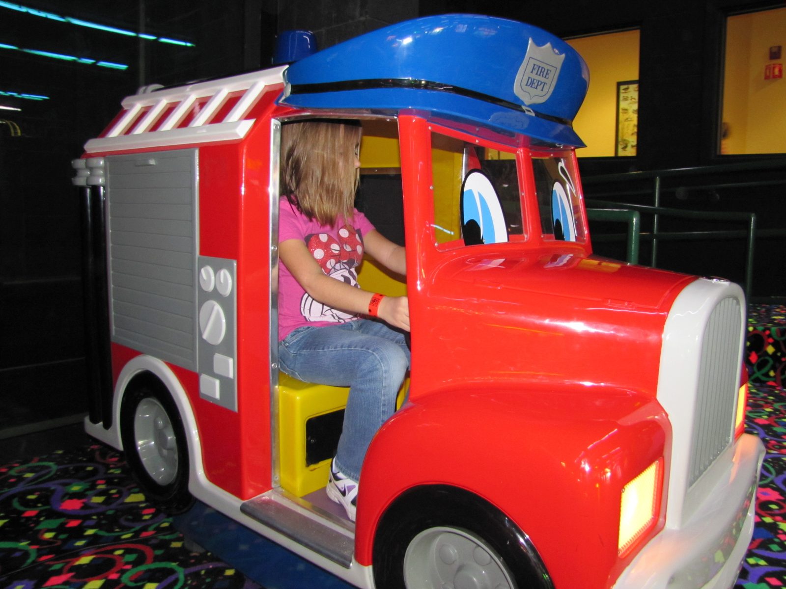 Lisa riding the fire truck ride