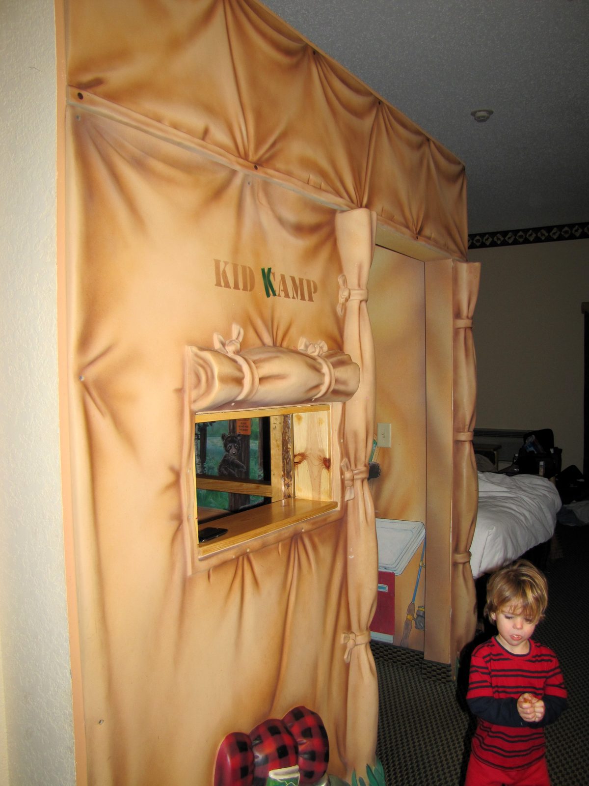Thomas peeks out of the Kid Kamp tent bed
