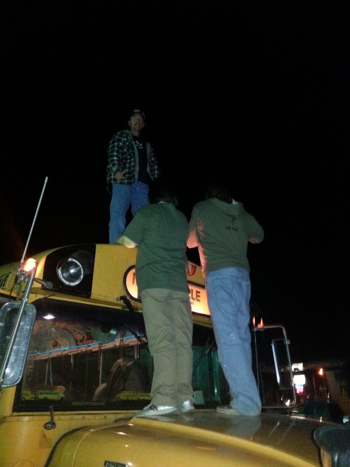 On top of the bus outside the show