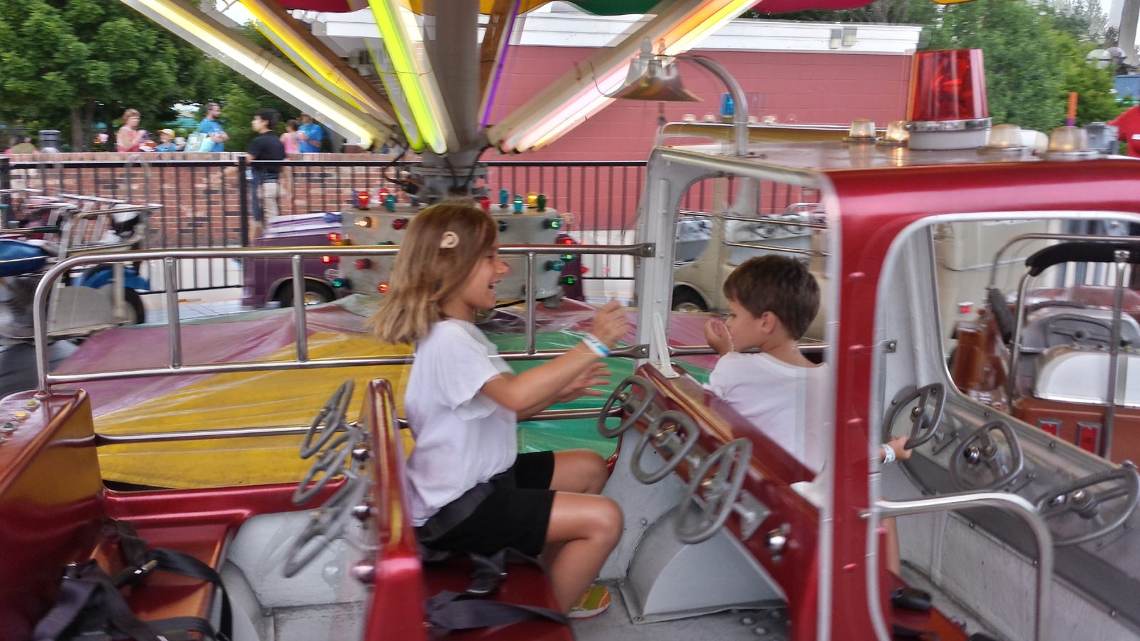 Lisa driving the toy car with Thomas