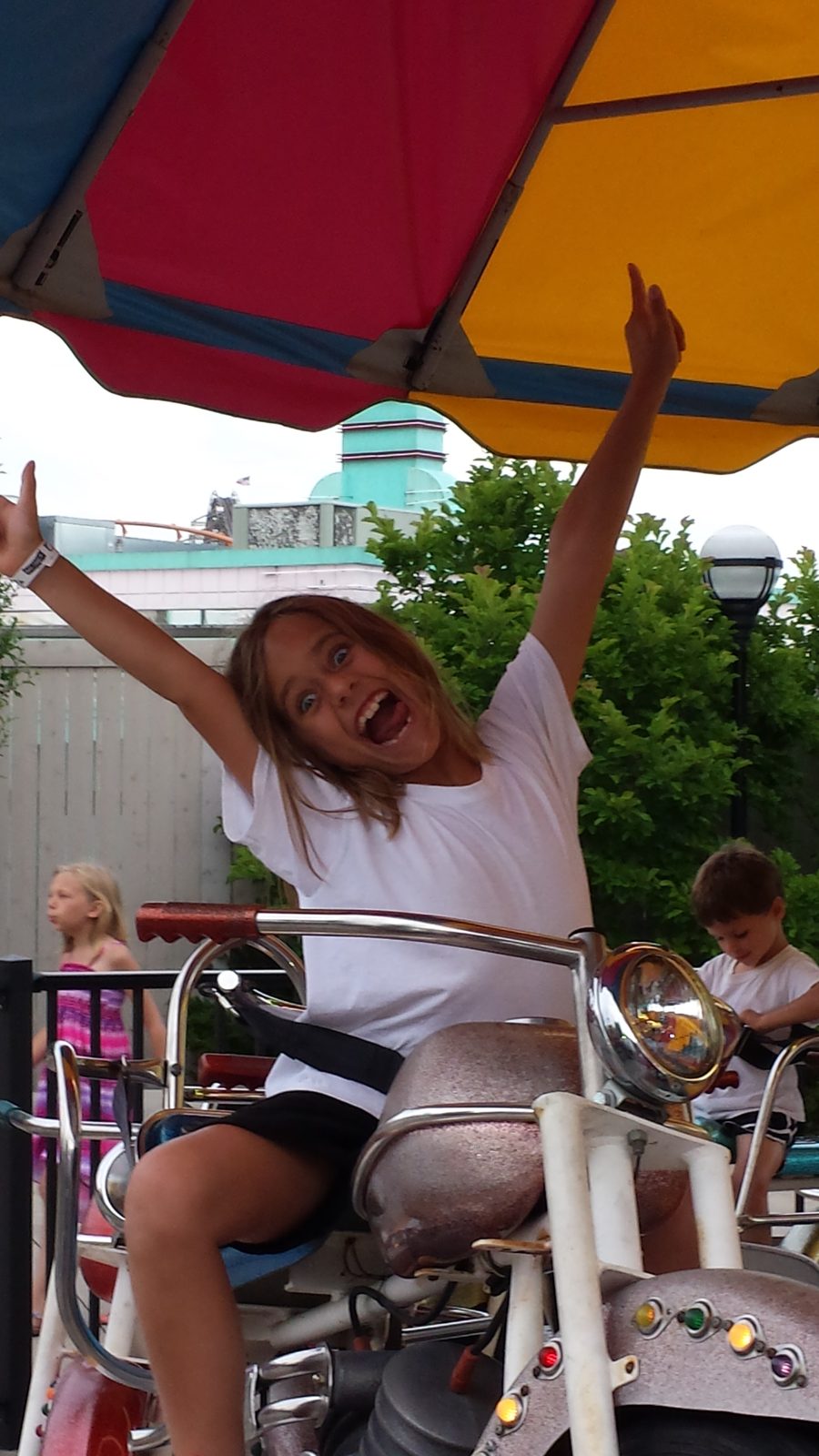 Lisa riding the spinning cycle ride