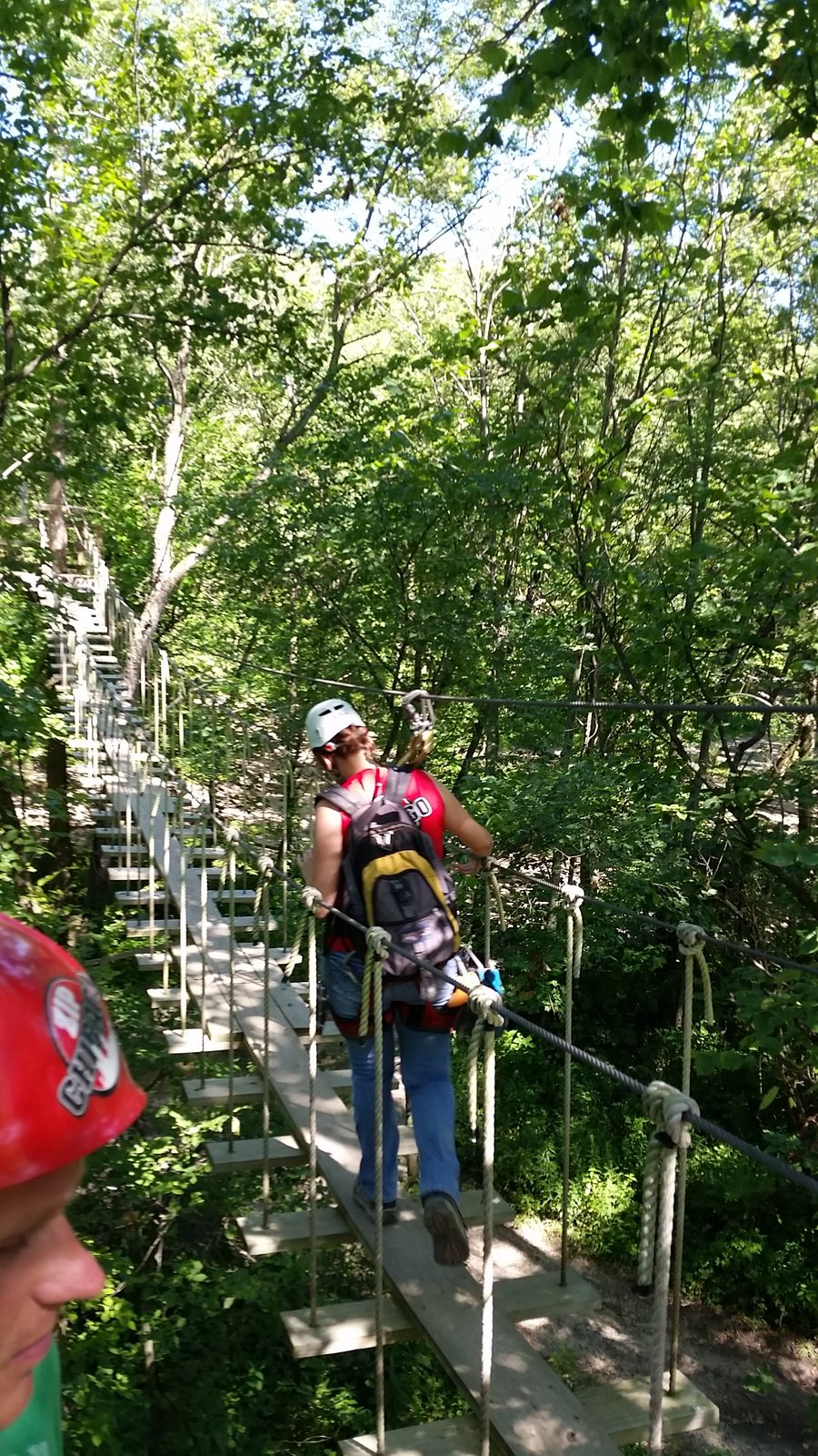 Crossing the aerial bridge on the ziplining course