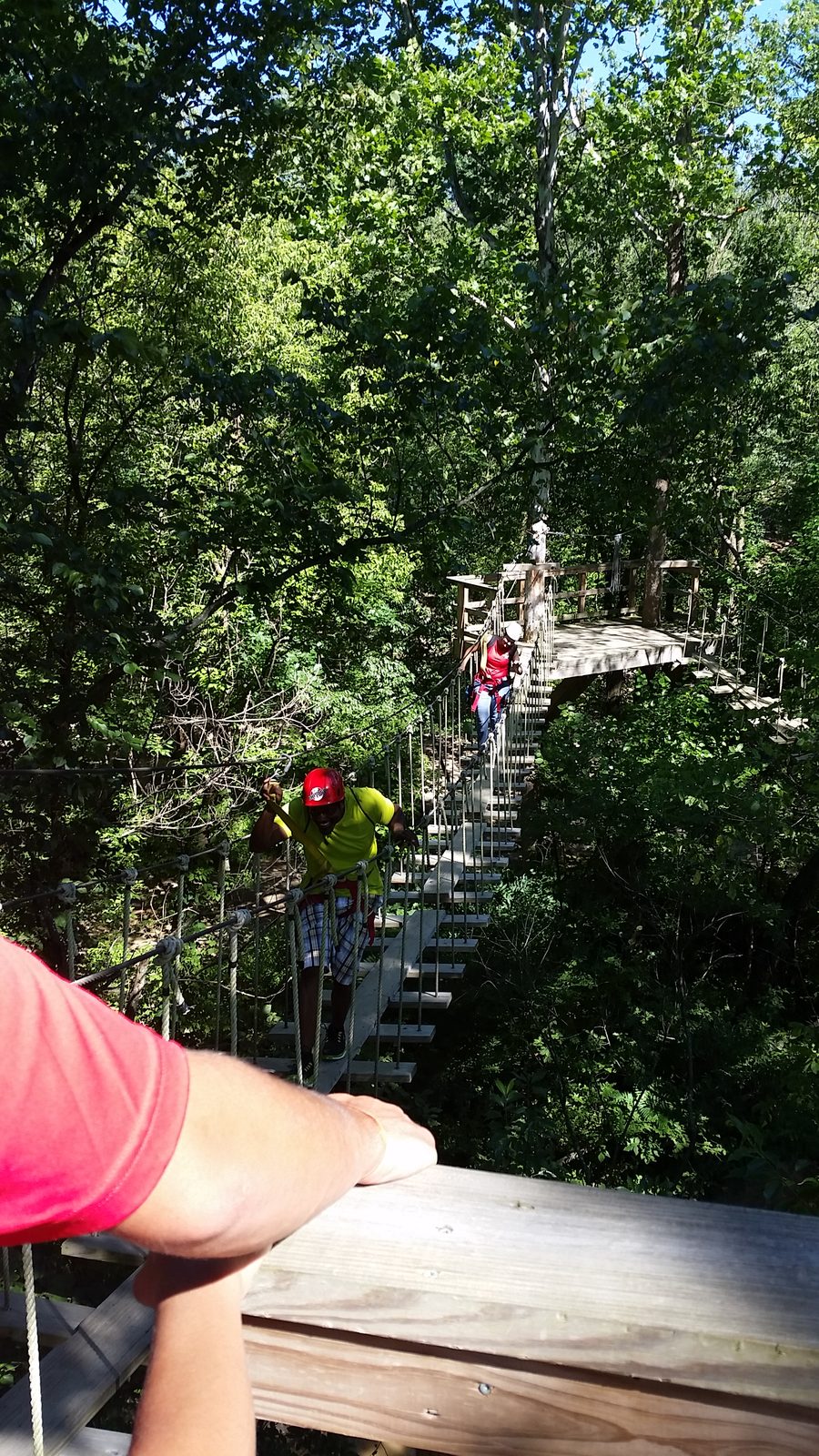 Crossing a high rope bridge