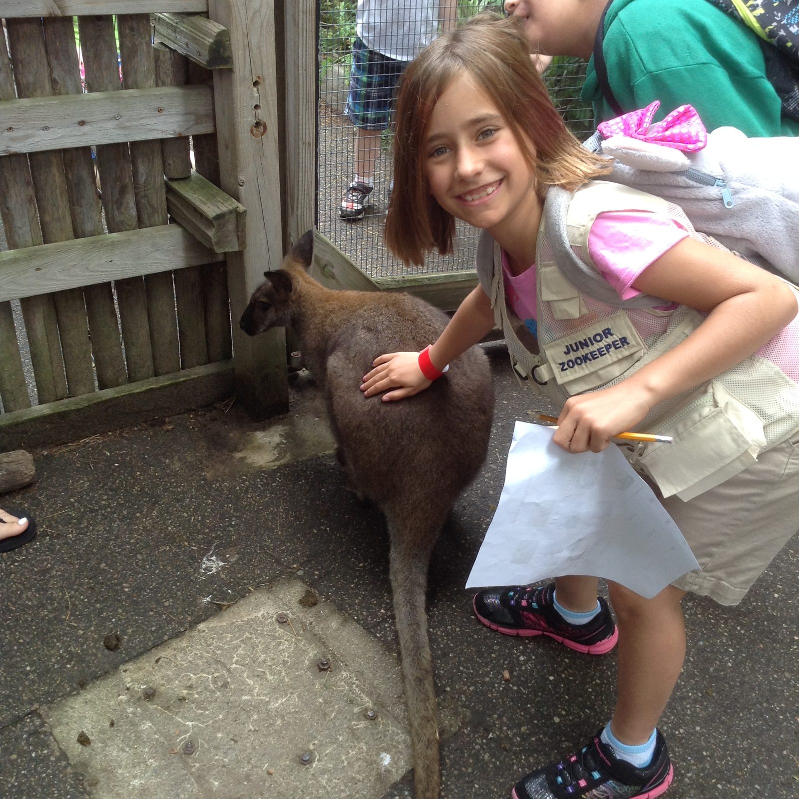 Lisa petting a wallaby at the petting zoo