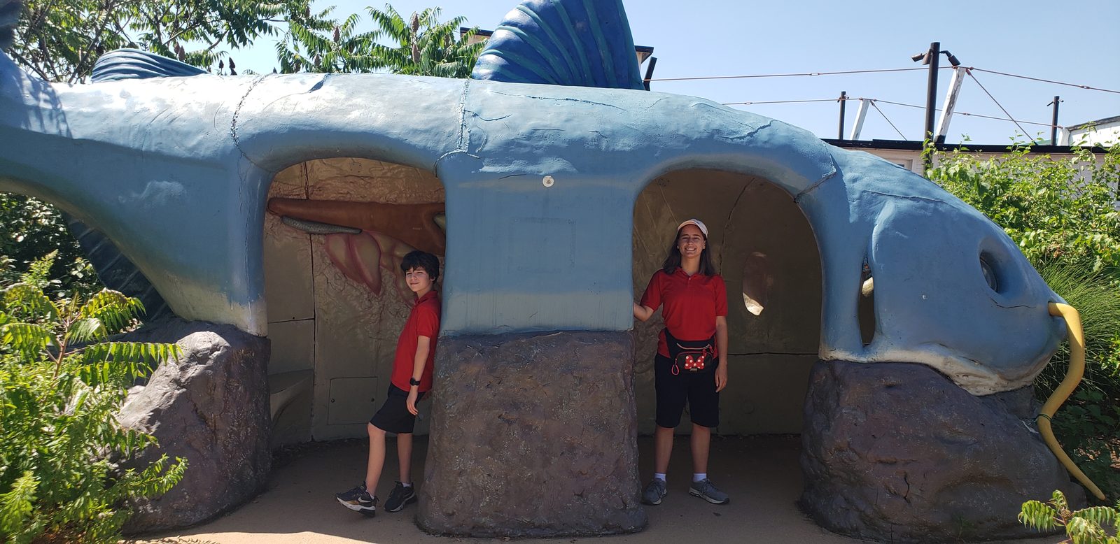 Thomas and Lisa play in the giant fish sculpture