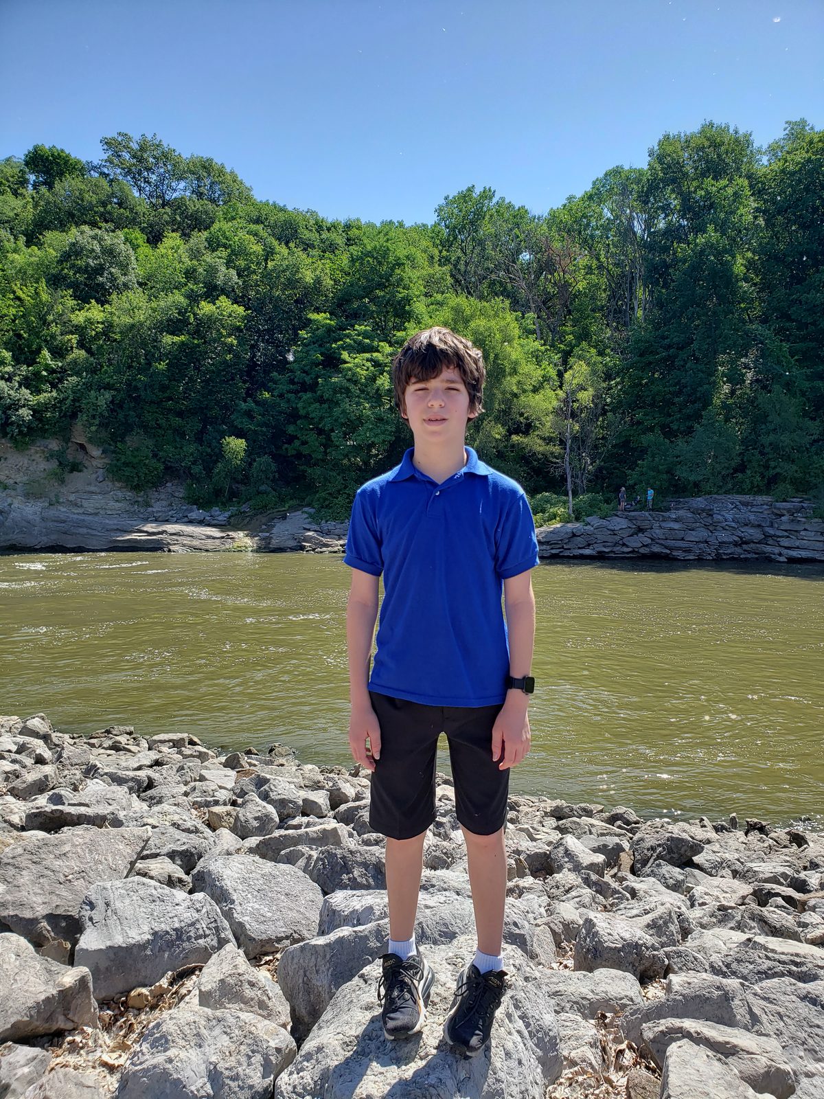 Thomas on the rocks at the Devonian Fossil Gorge