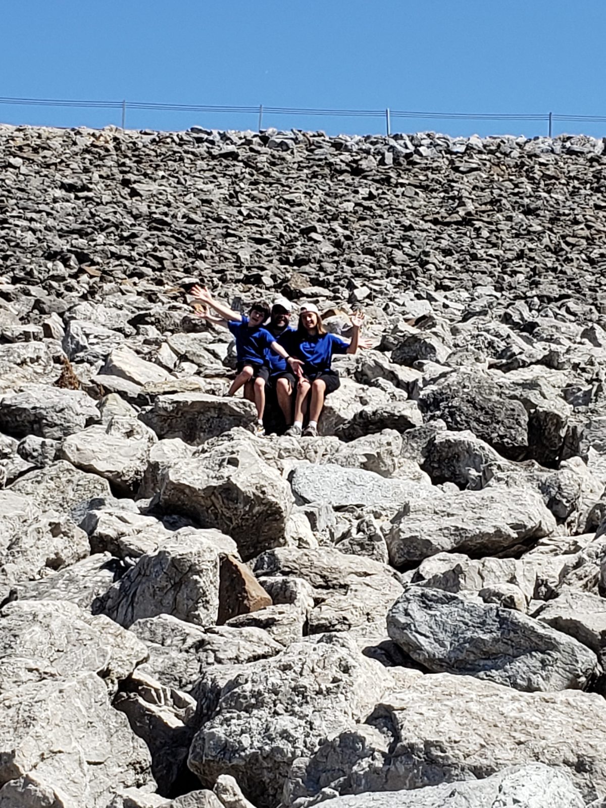 The family exploring the rocks at Devonian Fossil Gorge