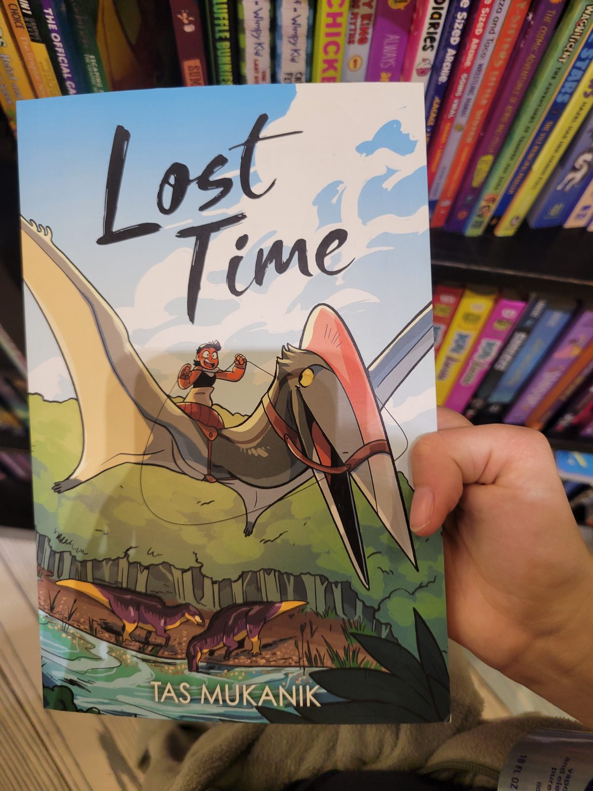 Browsing books before the overnight flight