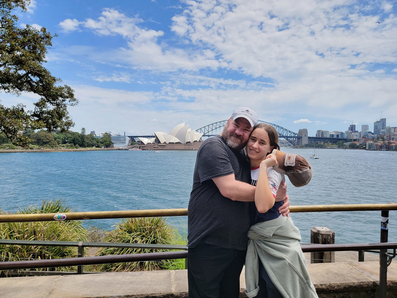 A hug with the Opera House behind