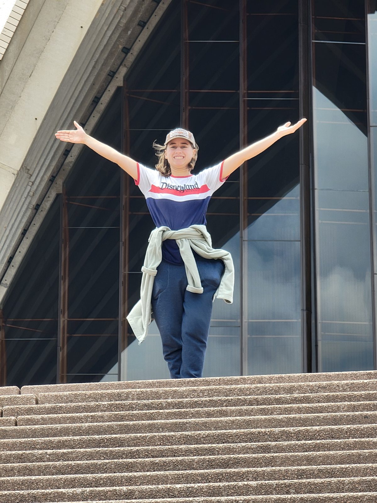 Lisa jumping for joy on the Opera House steps