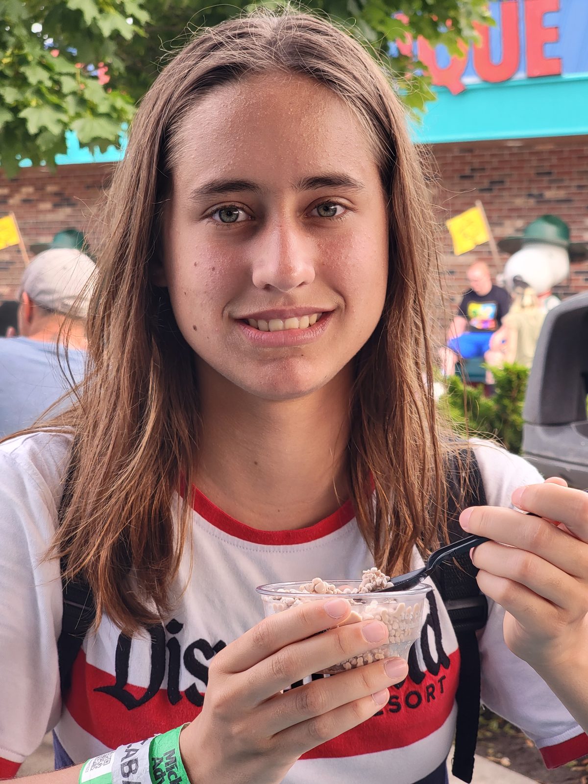 Lisa snacking between rides