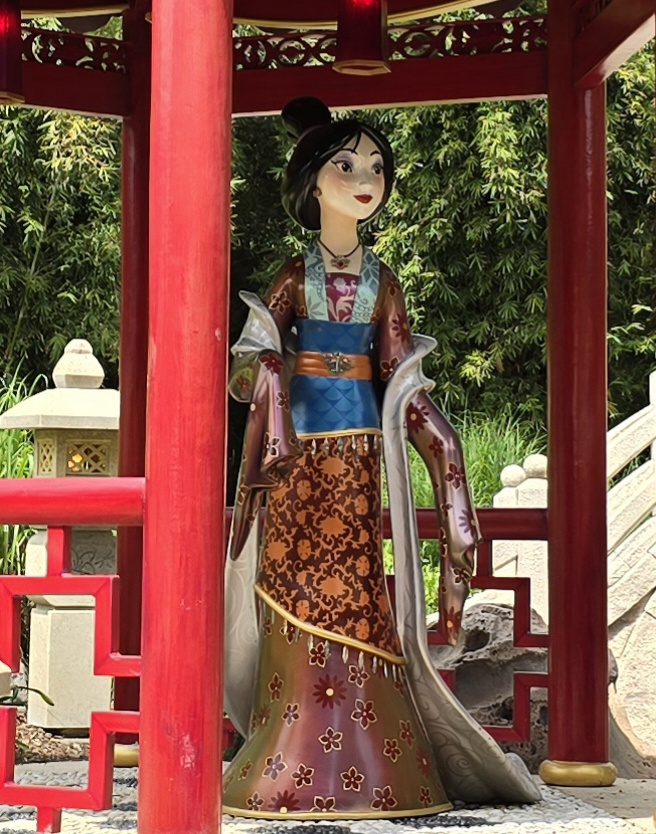 A Mulan statue guarding the gardens at Disneyland