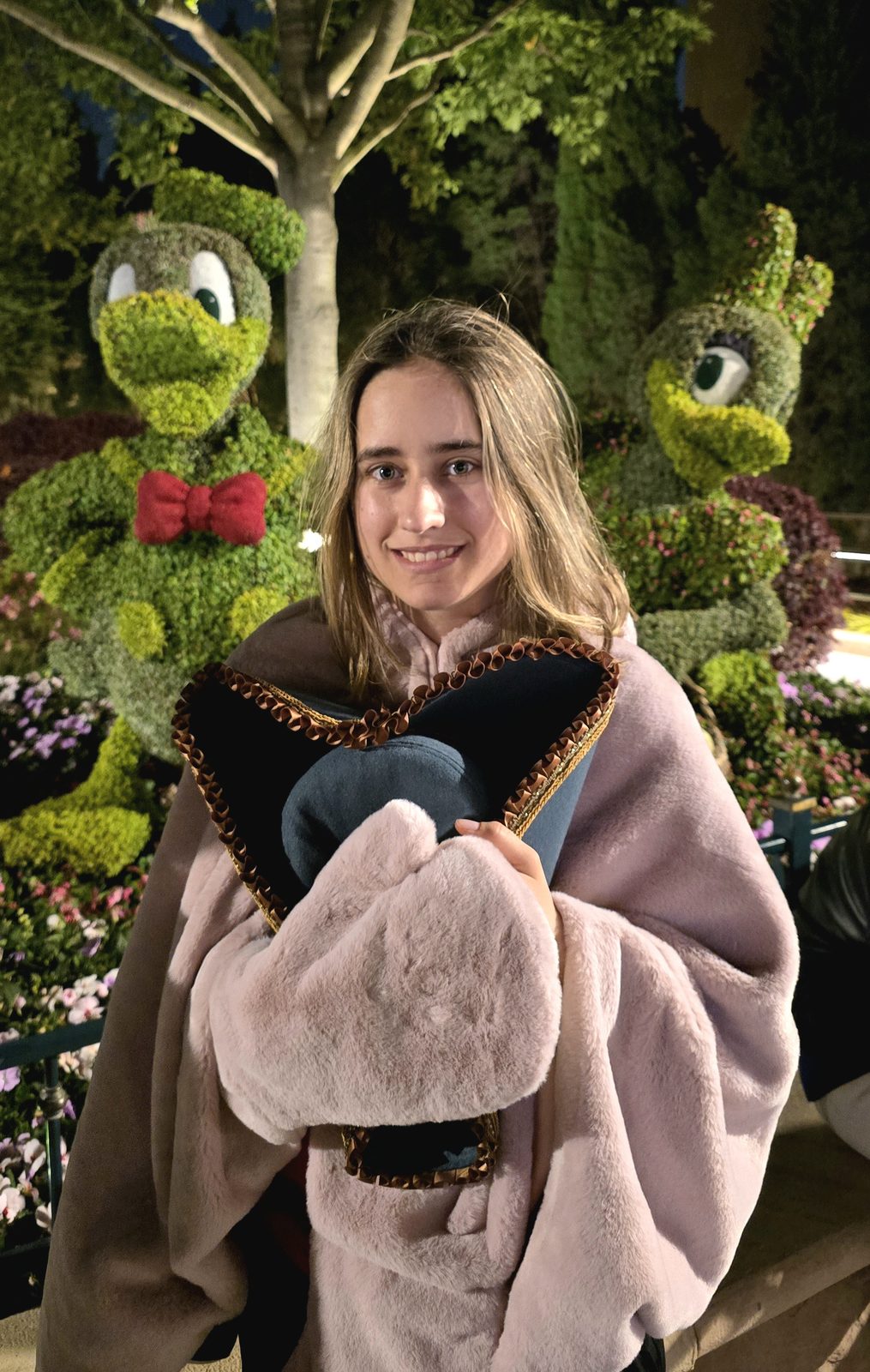 Lisa in a new robe by the topiaries