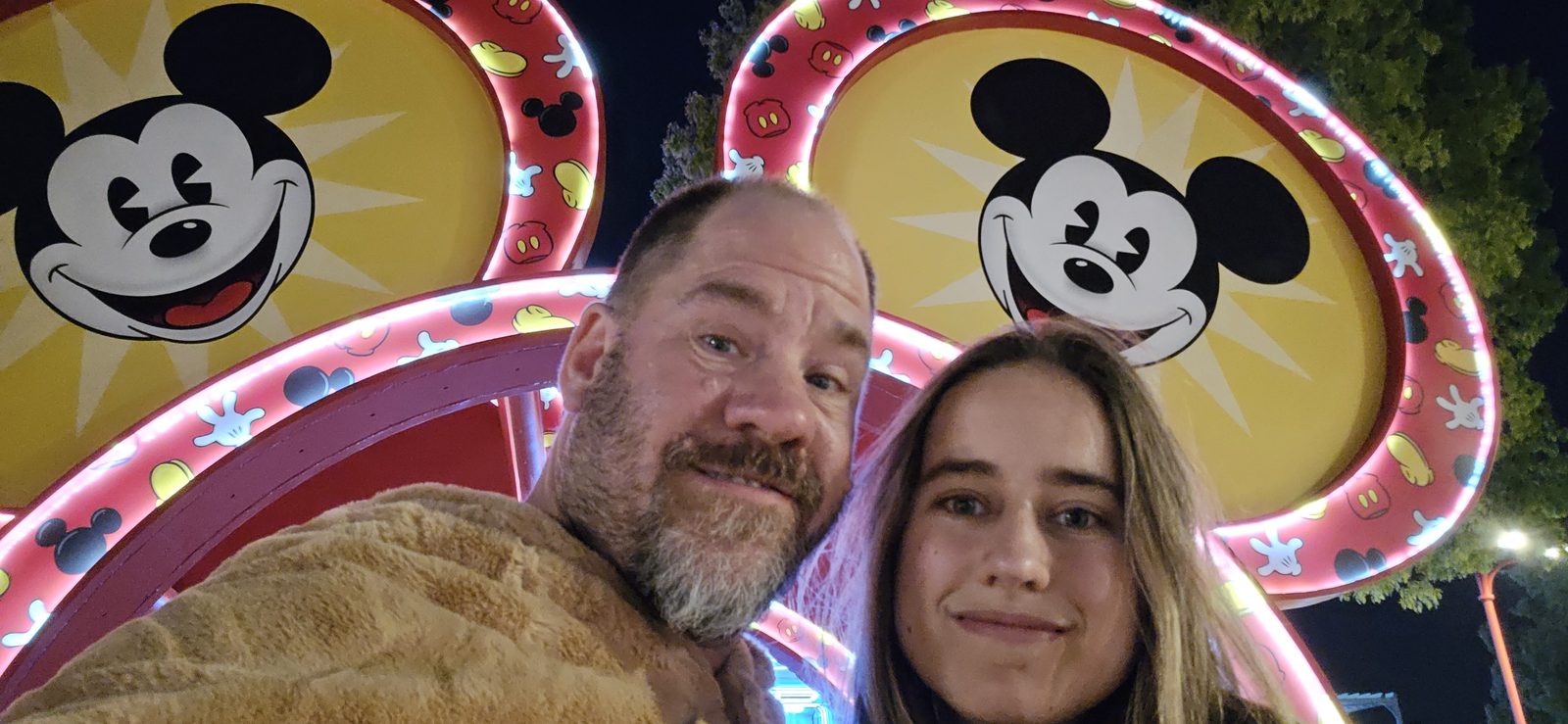 Under the lit Mickey ear arches