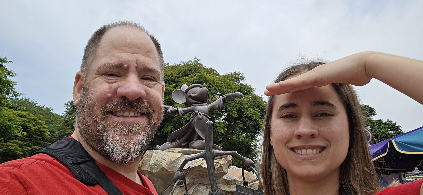 Lisa and me with a Mickey statue at Hong Kong Disneyland