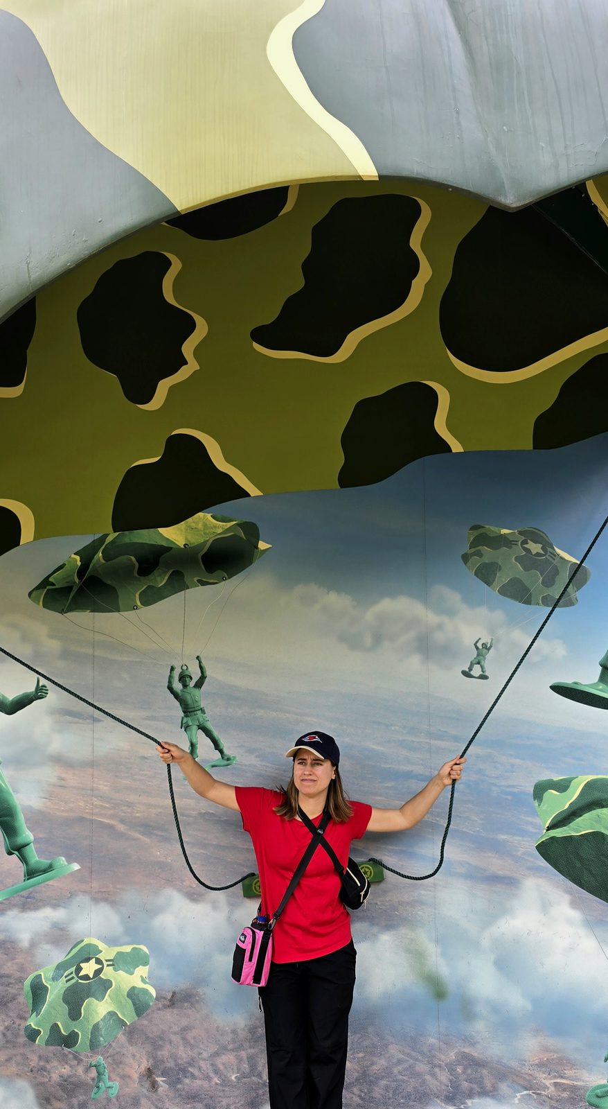 Lisa under the army men parachutes in Toy Story Land