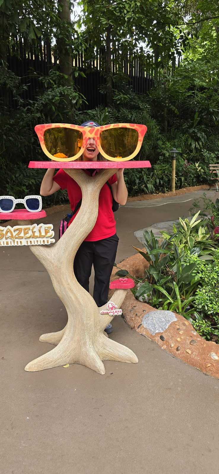 Lisa poses under a pair of oversized sunglasses