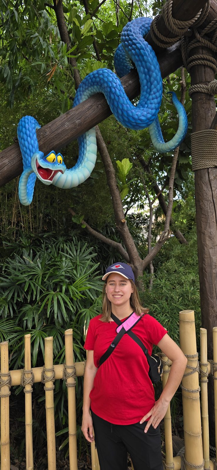 Lisa with a big blue snake in Adventureland