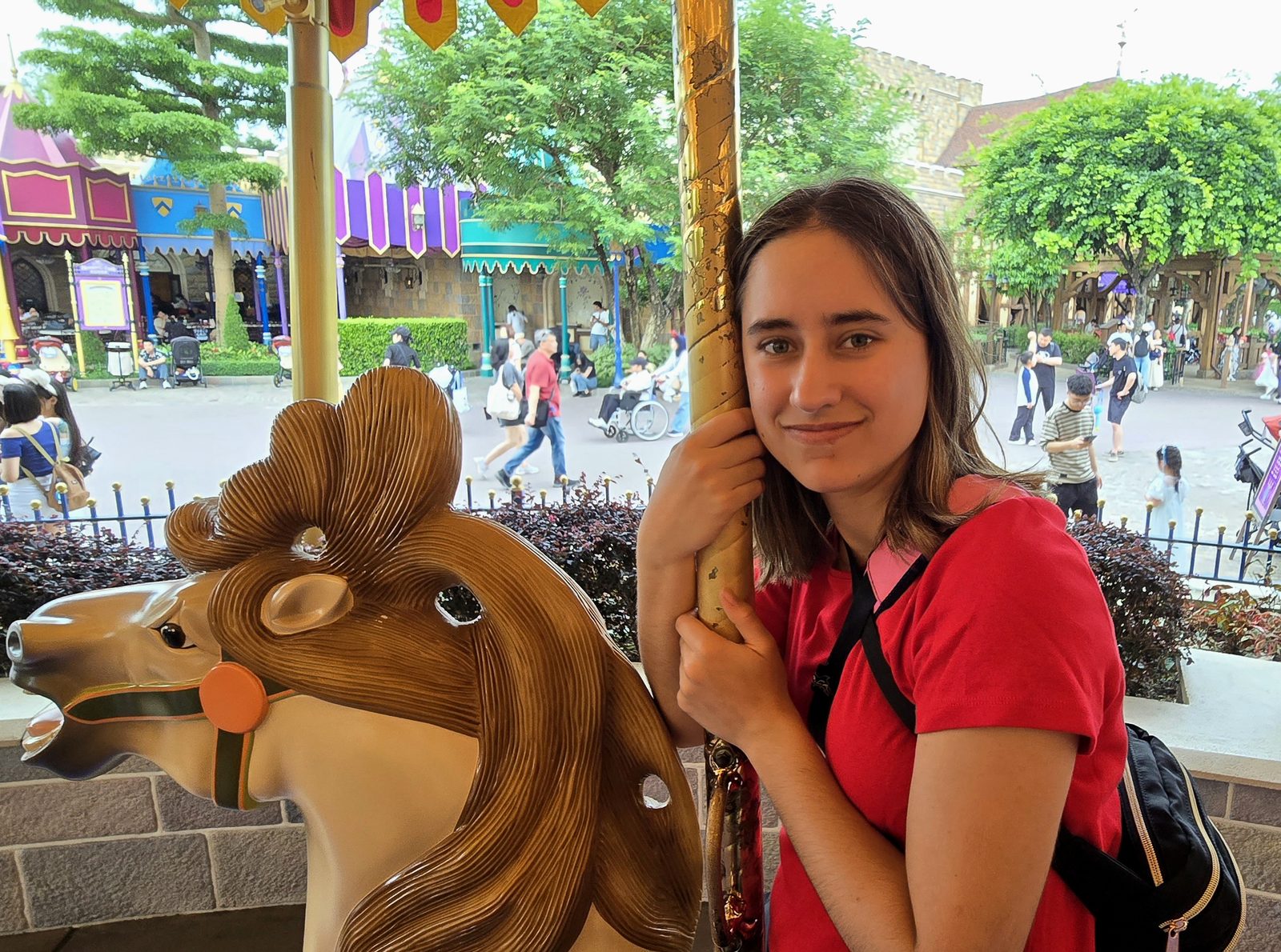 Lisa on a carousel horse in Fantasyland