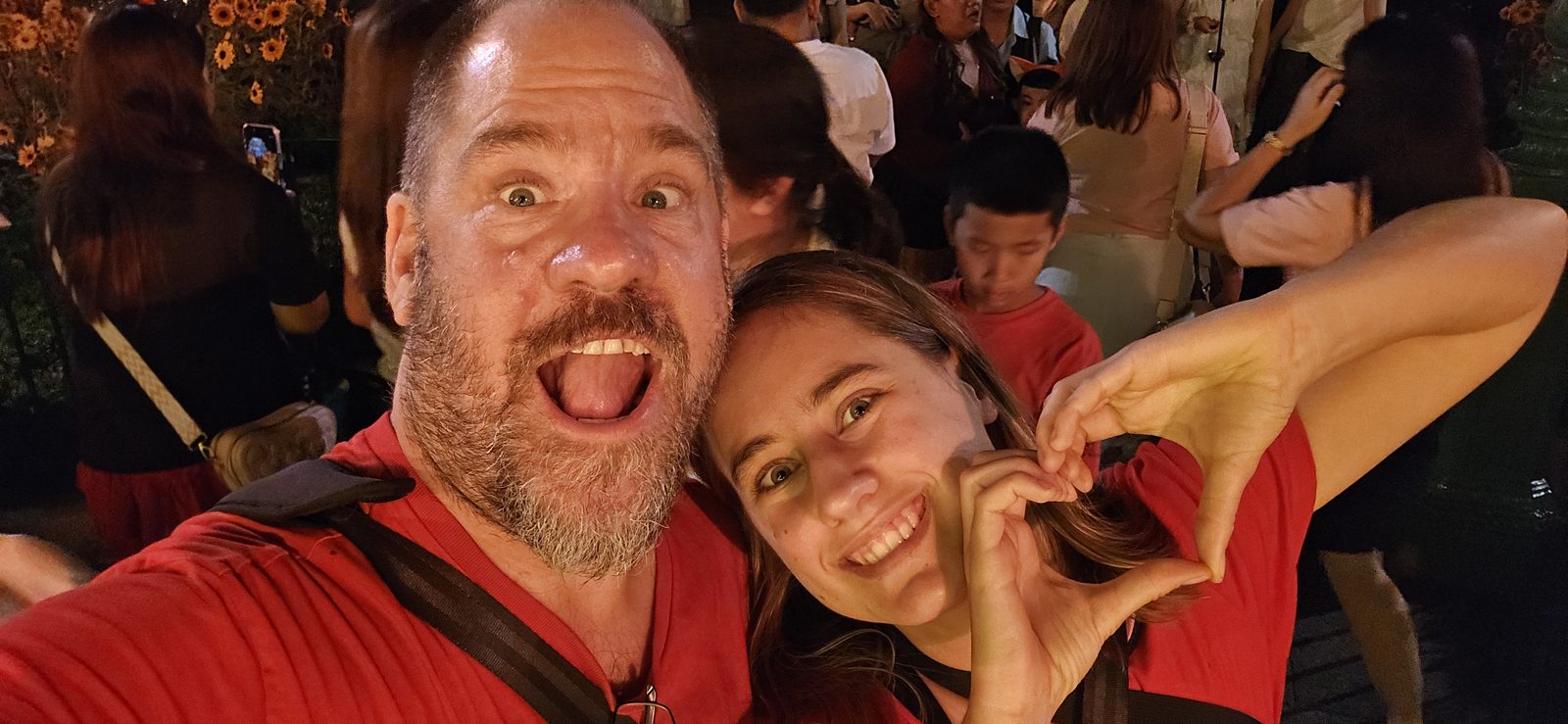 Lisa and me making a heart at Hong Kong Disneyland