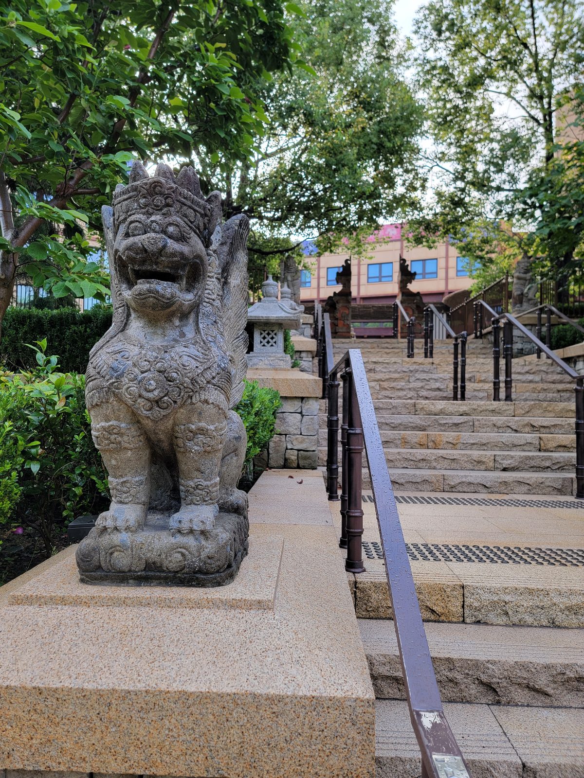A stone lion along the garden path