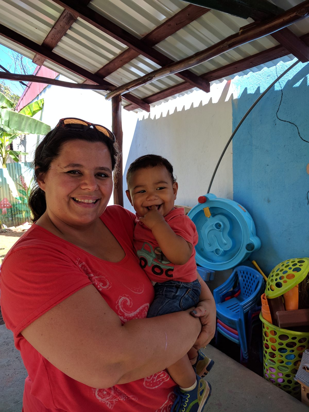 Kathy holding one of the children at the community center