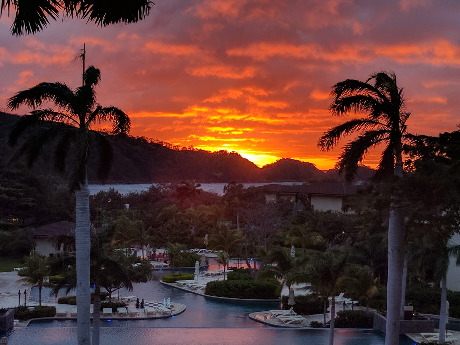 Sunset over the pools at Dreams Las Mareas