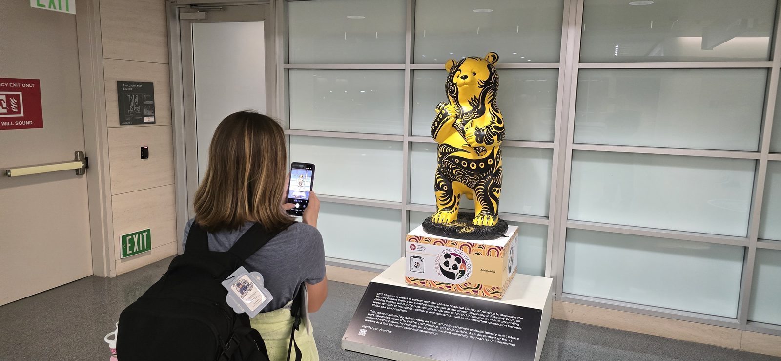 Lisa photographs a golden panda statue