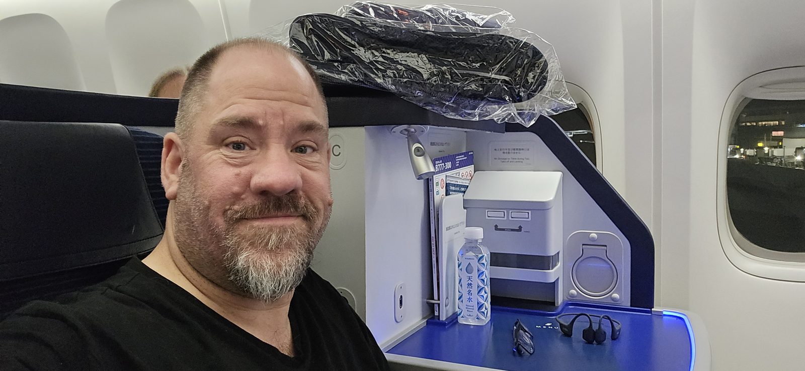 Settling into my seat for the flight to Tokyo