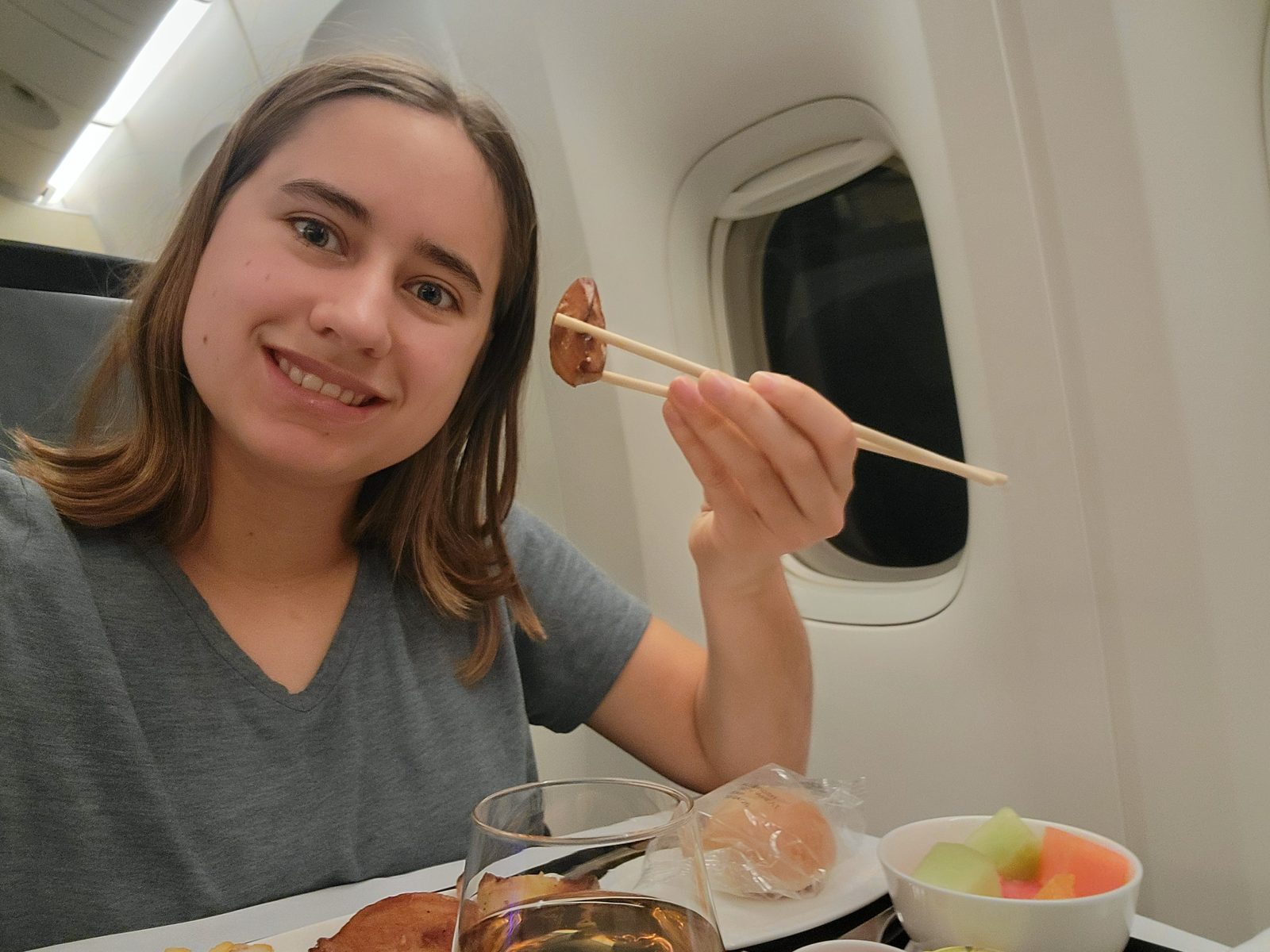 Lisa working the chopsticks on the flight