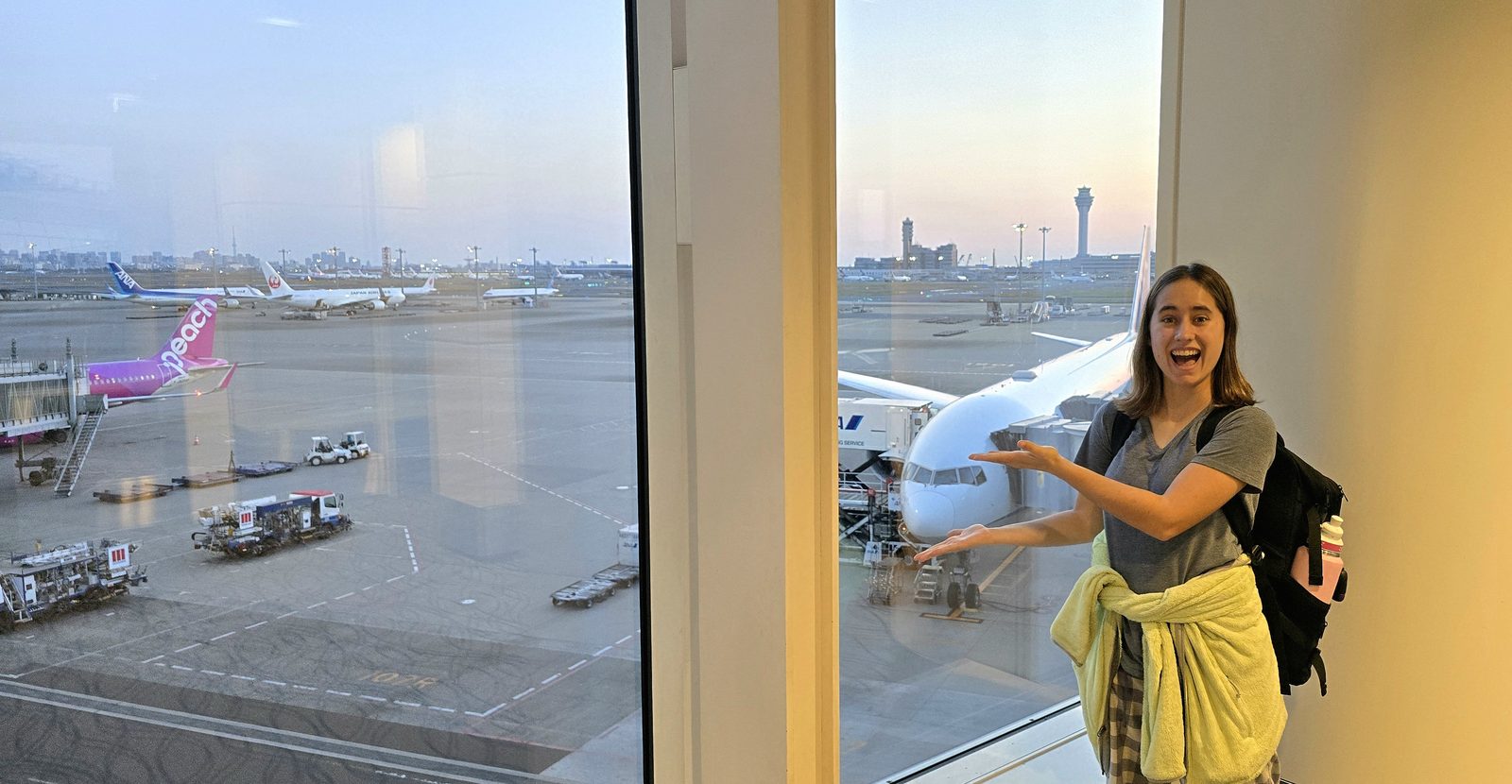 Lisa at a Haneda window at dawn