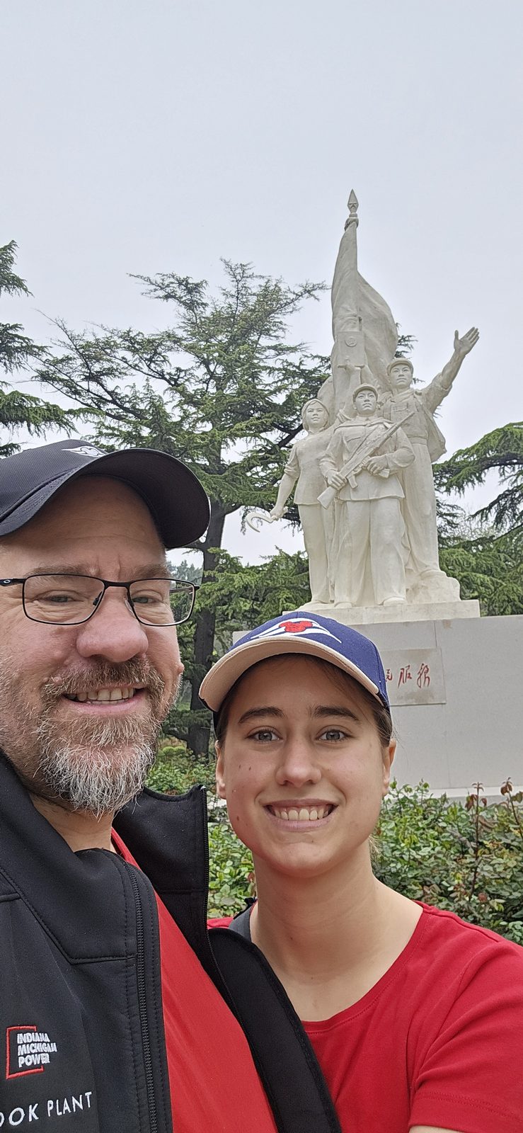 Lisa and me by a white statue in Dongdan Park
