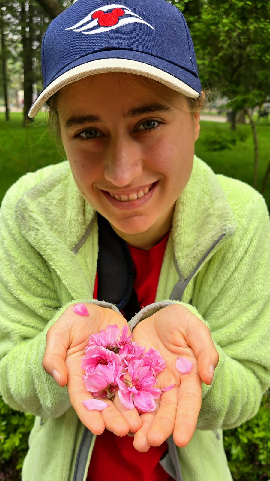 Cherry blossom petals in her hands
