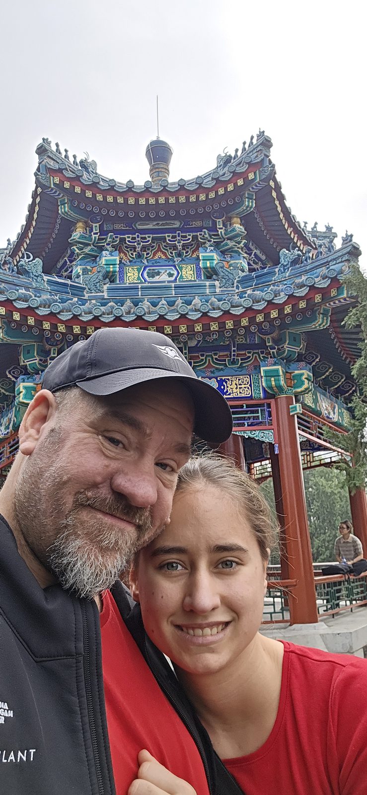 Lisa and me beside a painted pavilion in Dongdan Park