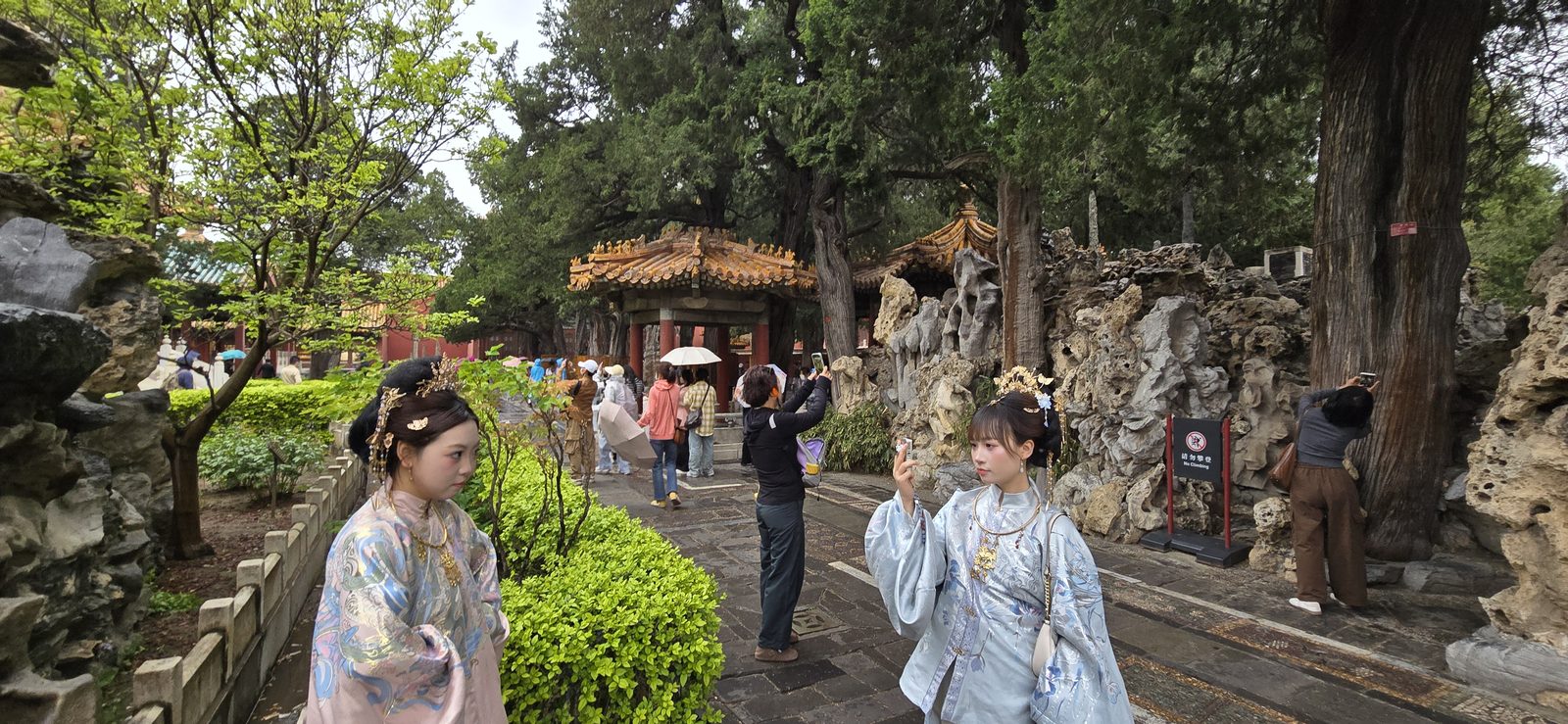 Visitors in traditional dress in the Forbidden City garden