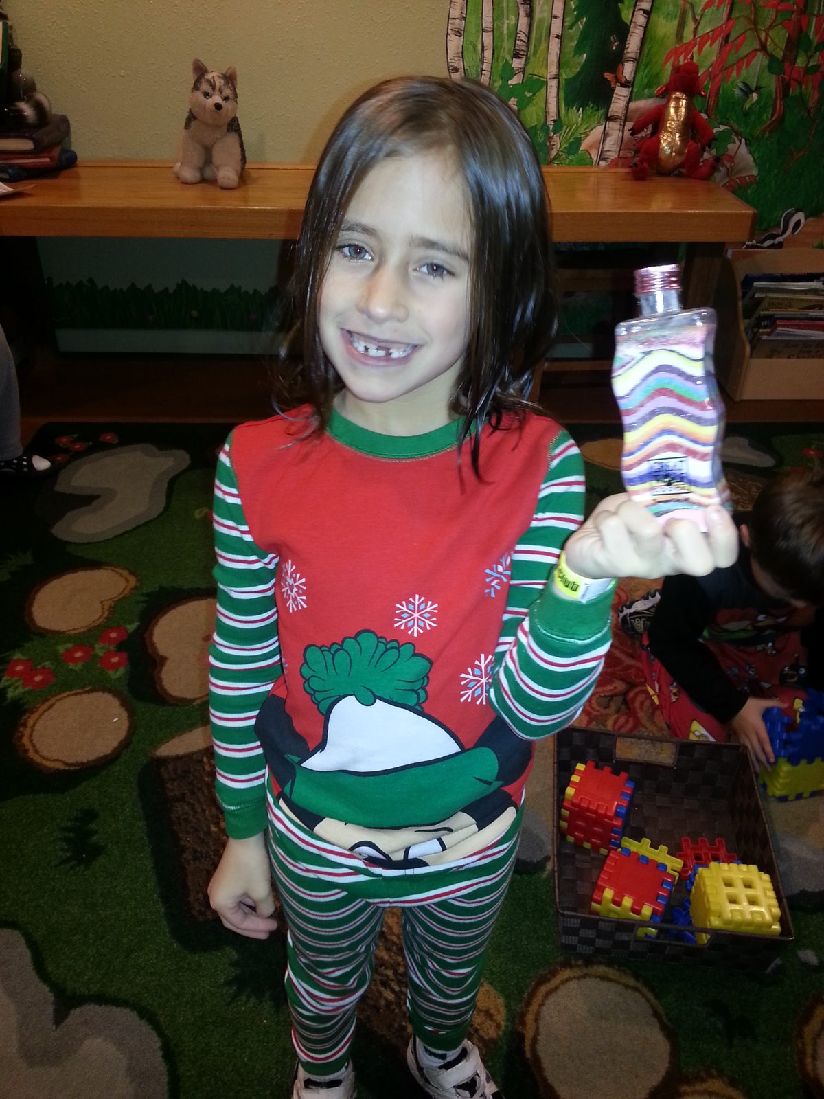 Lisa showing off her colored sand bottle