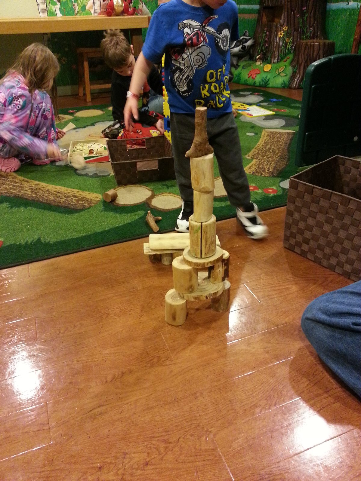 Thomas building with blocks by the play area