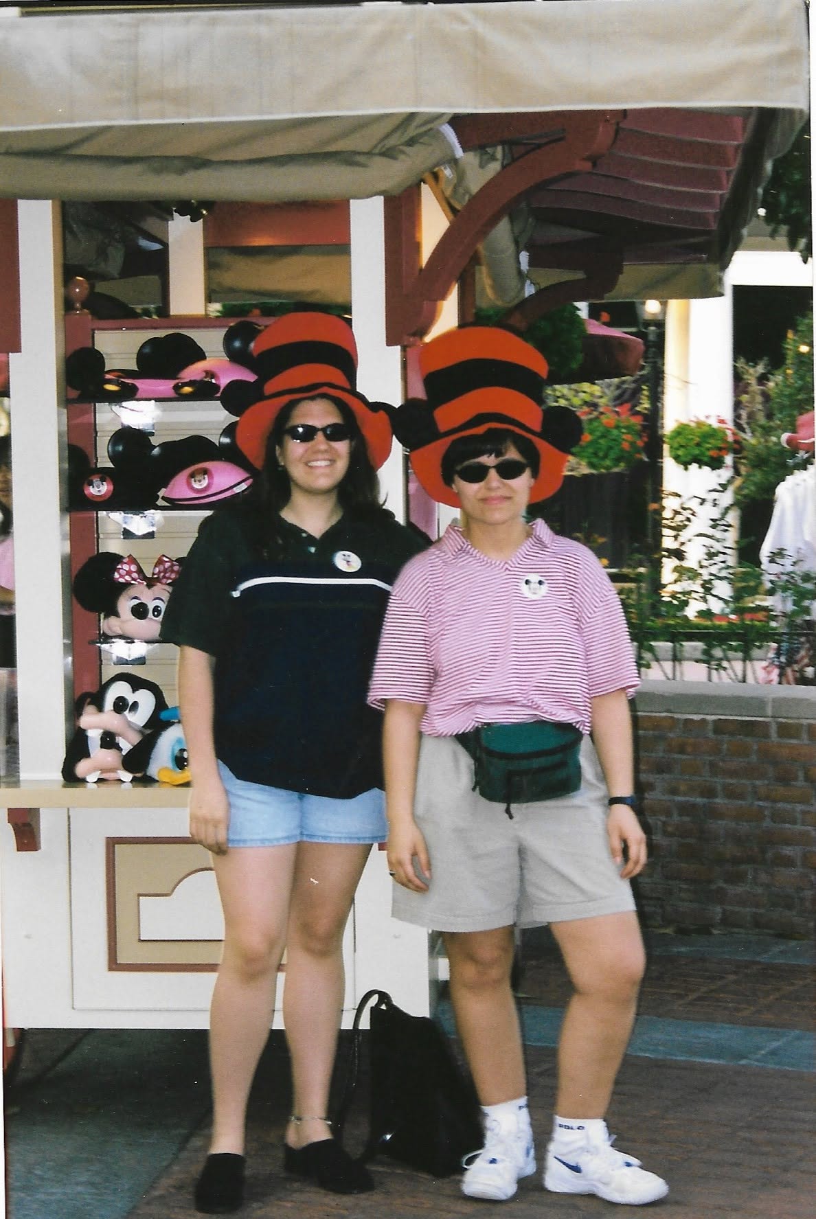 Kathy and a friend trying on hats at the Magic Kingdom